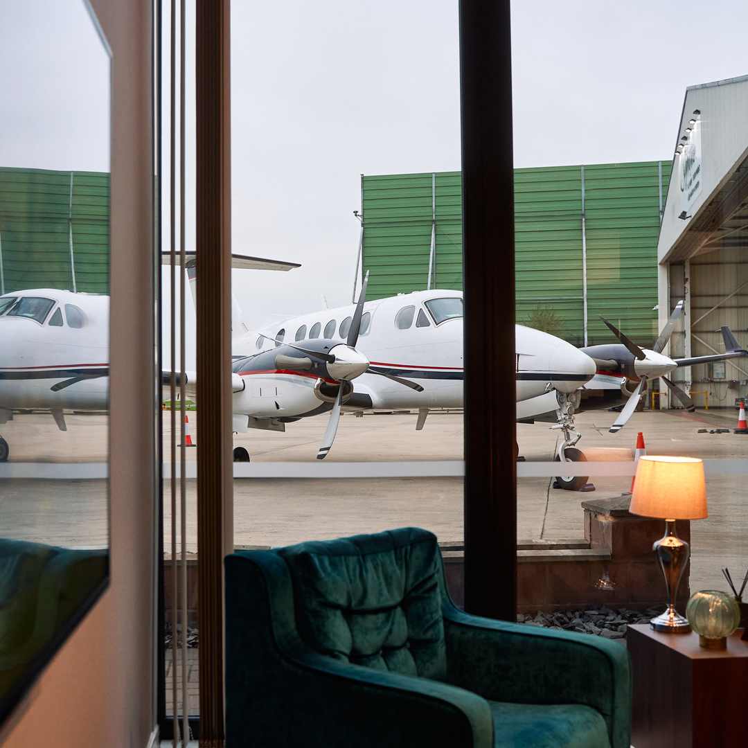 The view of a charter plane from inside a private VIP terminal